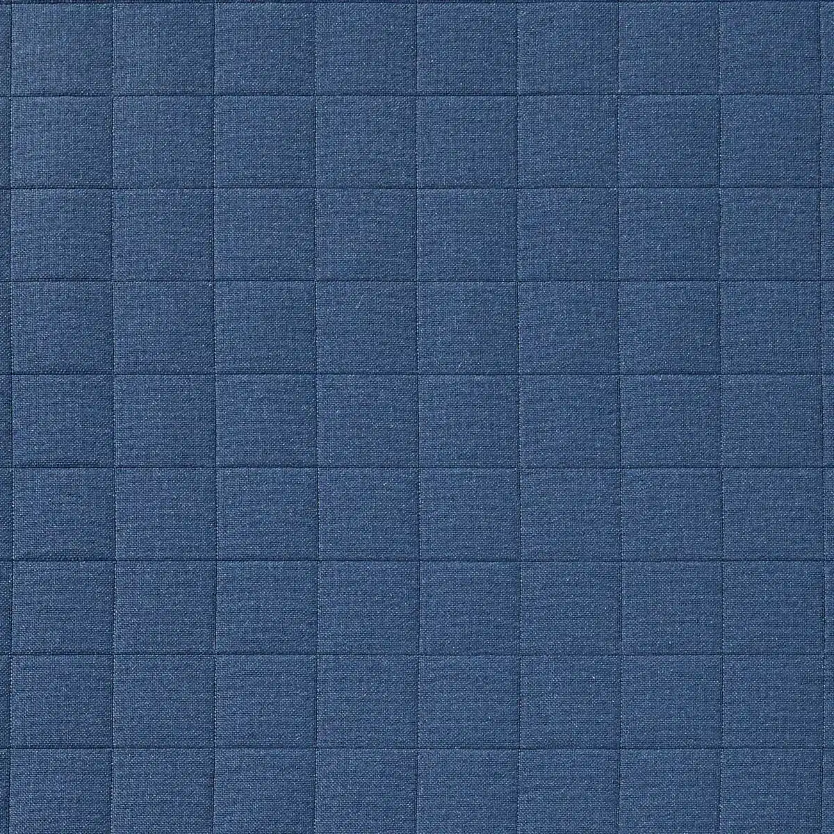 A grid-like blue fabric pattern, featuring square stitching. The texture appears soft and quilted, suggesting use for upholstery or interior design.